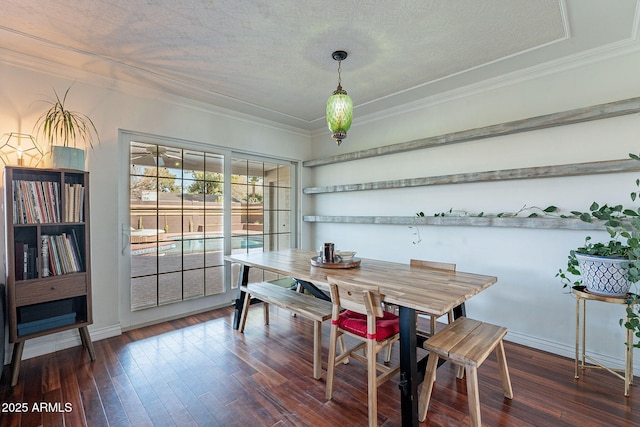 dining room featuring crown molding, a textured ceiling, and dark hardwood / wood-style flooring