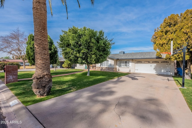 ranch-style house featuring a garage and a front lawn