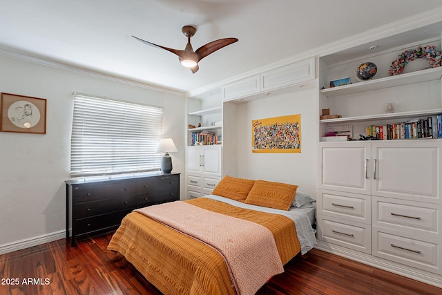 bedroom featuring crown molding, dark hardwood / wood-style floors, ceiling fan, and a closet