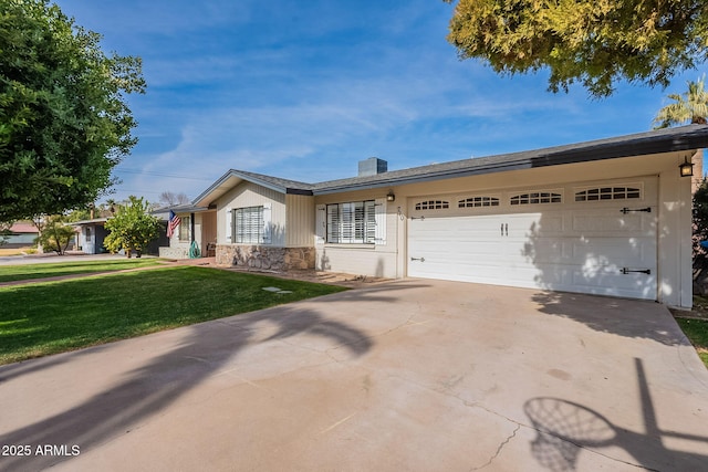 single story home with a garage and a front lawn