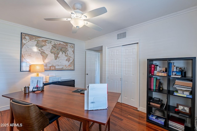 home office with dark hardwood / wood-style flooring, ornamental molding, and ceiling fan