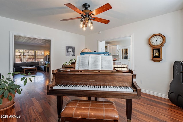 miscellaneous room with dark wood-type flooring and ceiling fan