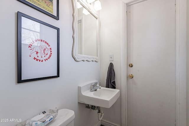 bathroom with toilet and sink