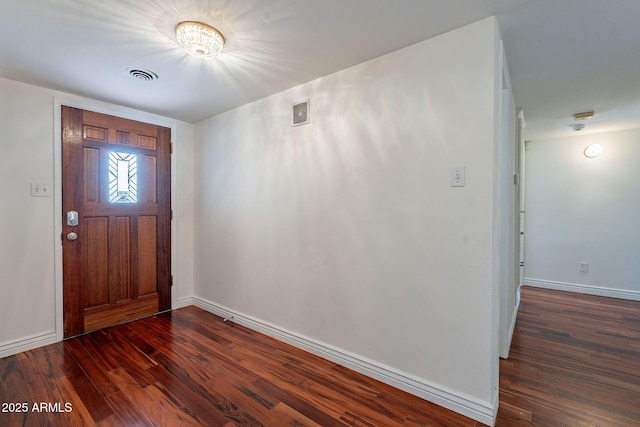 entryway with dark hardwood / wood-style flooring