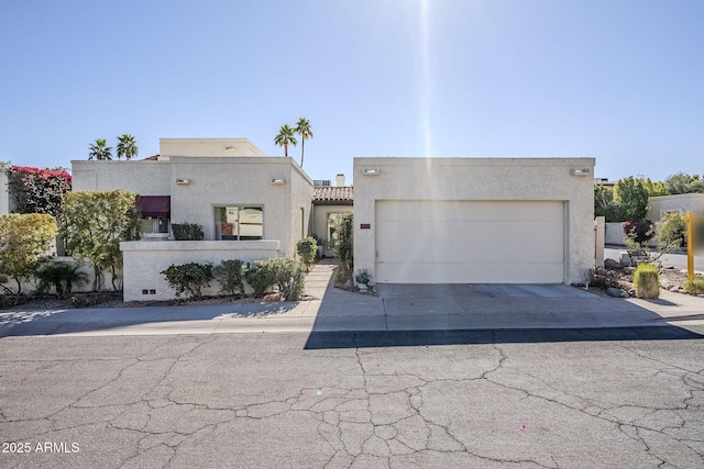 adobe home featuring a garage