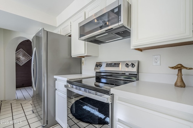 kitchen featuring white cabinetry, light tile patterned floors, and appliances with stainless steel finishes