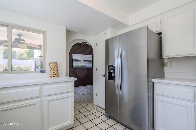 kitchen with white cabinetry, stainless steel fridge with ice dispenser, and ceiling fan