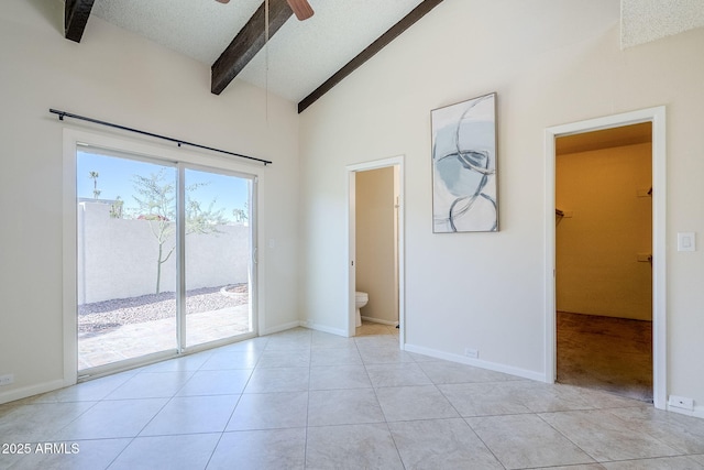 unfurnished room with high vaulted ceiling, a textured ceiling, light tile patterned floors, ceiling fan, and beam ceiling