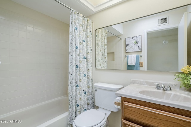 full bathroom featuring vanity, shower / bath combination with curtain, and toilet