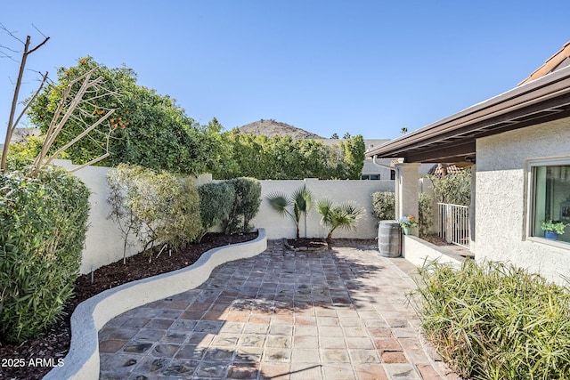 view of patio / terrace with a mountain view