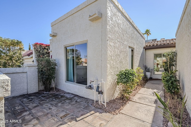 view of home's exterior featuring a patio area