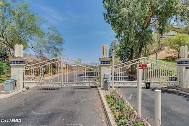 view of gate featuring a mountain view