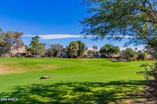 surrounding community featuring a lawn