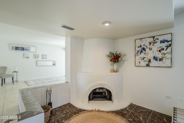 living room featuring a premium fireplace