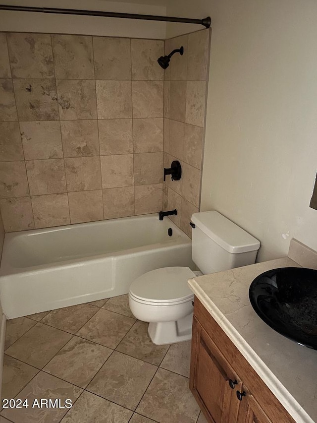 full bathroom with tile patterned floors, vanity, toilet, and tiled shower / bath