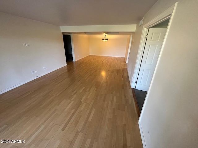 spare room with hardwood / wood-style floors