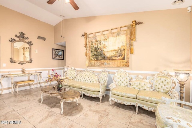 living room featuring ceiling fan, tile patterned flooring, and vaulted ceiling