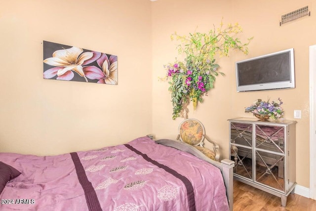 bedroom featuring wood-type flooring