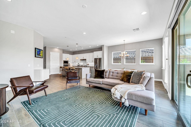 living room featuring an inviting chandelier