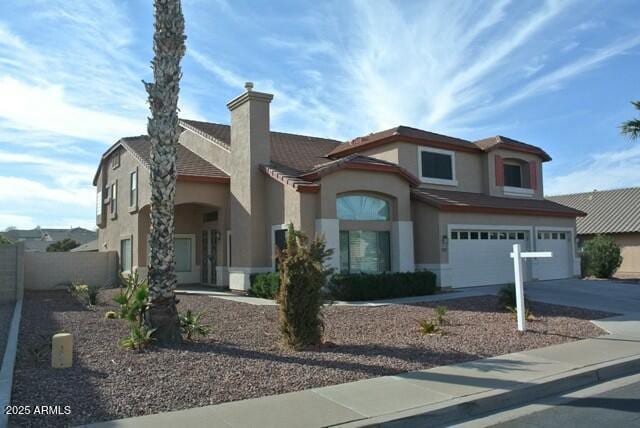 view of front of property with a garage