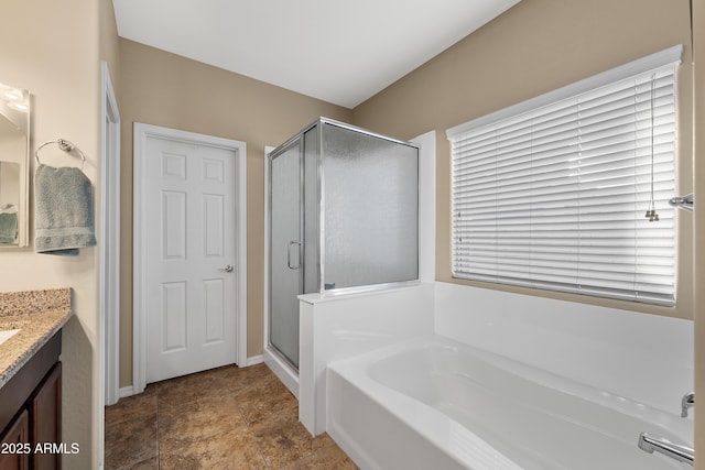 full bathroom featuring a garden tub, vanity, and a shower stall