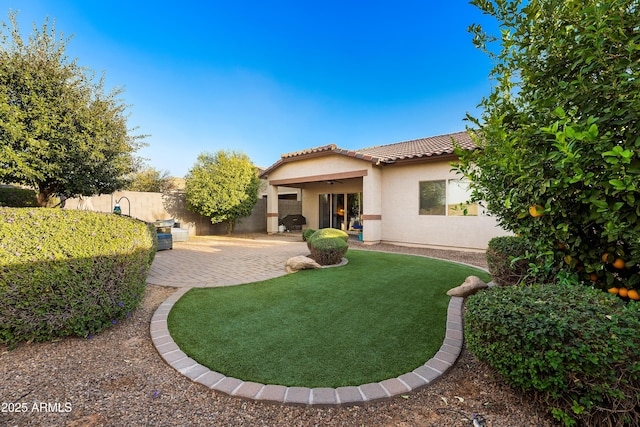 exterior space featuring ceiling fan, a patio area, and fence