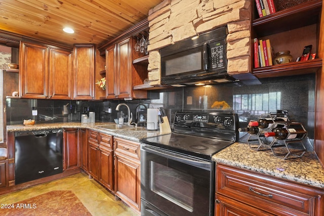 kitchen with sink, black appliances, decorative backsplash, and light stone counters