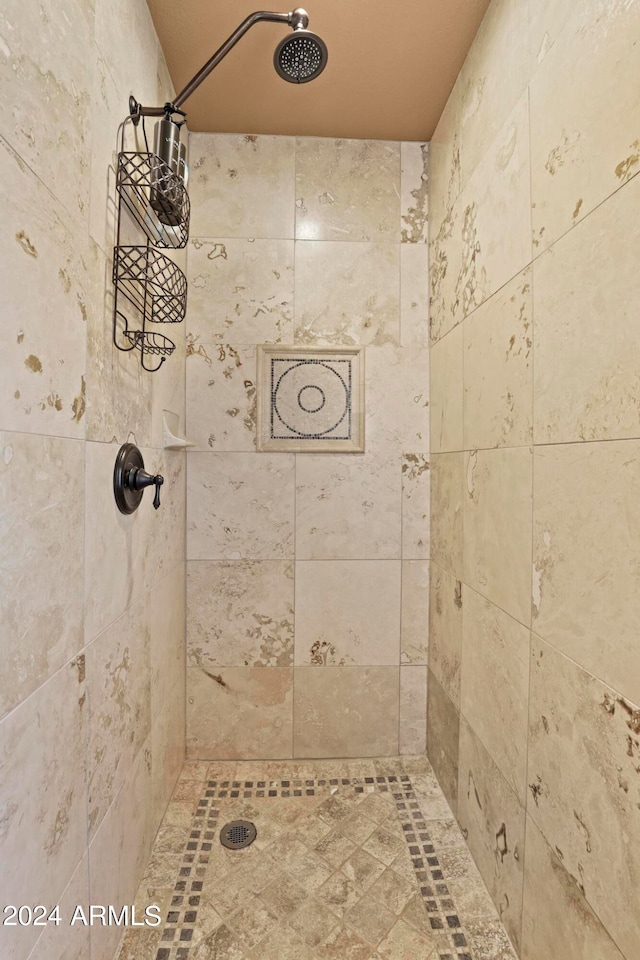 bathroom with tiled shower