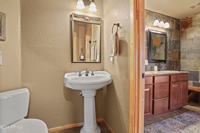 bathroom featuring sink and toilet