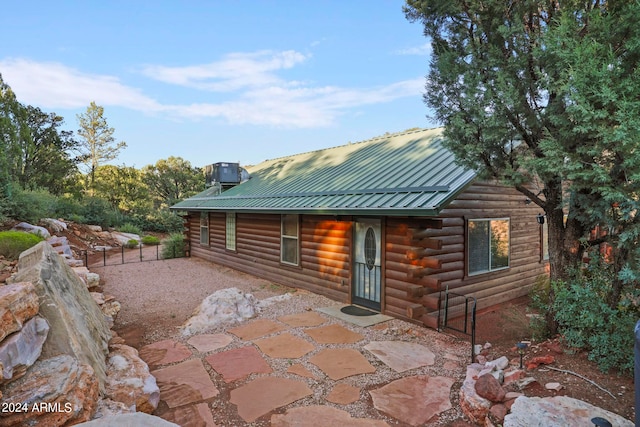 rear view of house featuring a patio and central AC unit