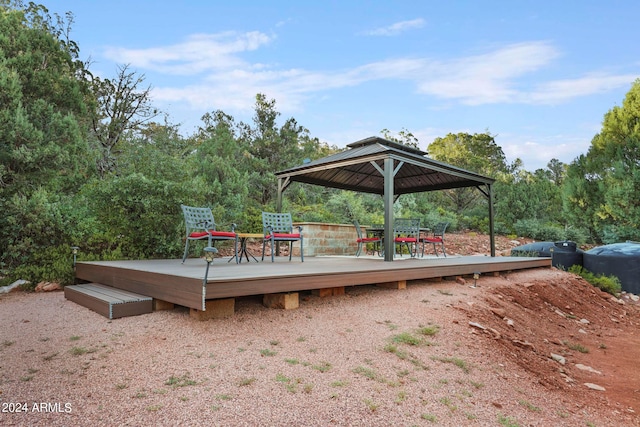 wooden terrace featuring a gazebo