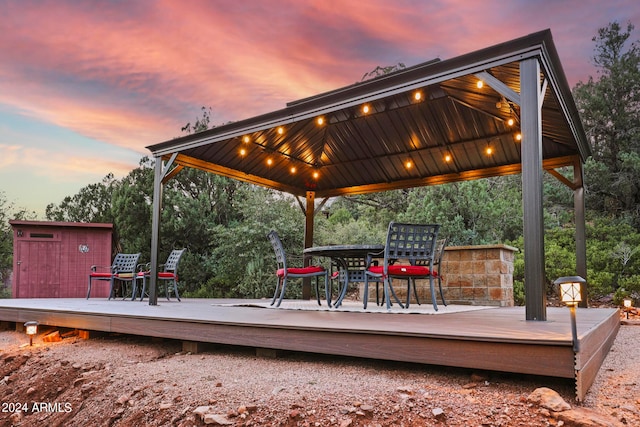 deck at dusk with a gazebo