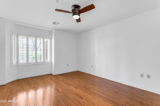 4200 N Miller Rd Unit 112, Scottsdale, AZ 85251 - unfurnished room with ceiling fan, wood finished floors, and baseboards