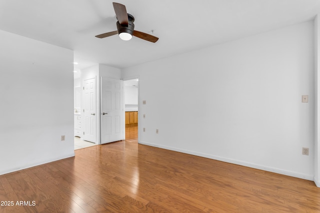 4200 N Miller Rd Unit 112, Scottsdale, AZ 85251 - spare room featuring ceiling fan, light wood-style flooring, and baseboards
