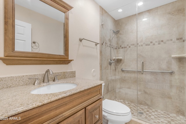 4200 N Miller Rd Unit 112, Scottsdale, AZ 85251 - full bathroom with a stall shower, toilet, vanity, and recessed lighting