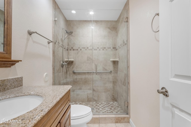 4200 N Miller Rd Unit 112, Scottsdale, AZ 85251 - full bathroom featuring a shower stall, toilet, vanity, and recessed lighting