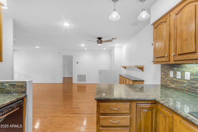 4200 N Miller Rd Unit 112, Scottsdale, AZ 85251 - kitchen with dishwasher, backsplash, light wood-type flooring, a ceiling fan, and decorative light fixtures