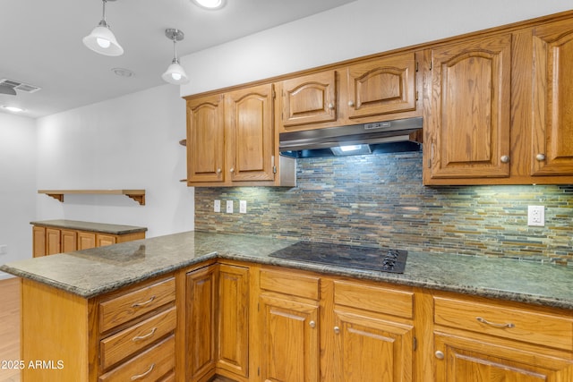4200 N Miller Rd Unit 112, Scottsdale, AZ 85251 - kitchen with black electric cooktop, under cabinet range hood, a peninsula, and tasteful backsplash