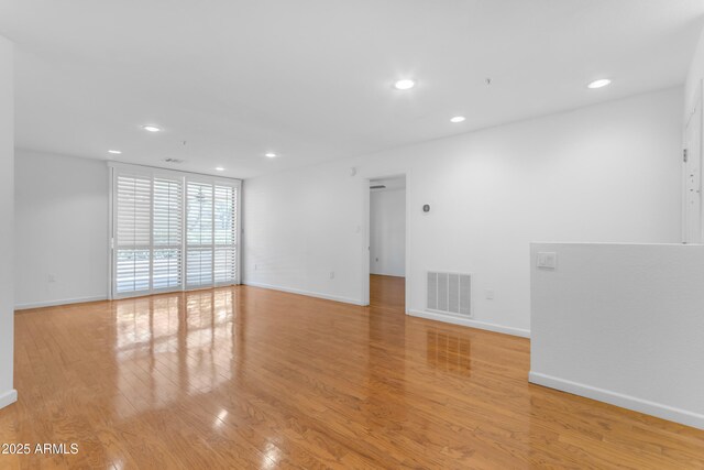 4200 N Miller Rd Unit 112, Scottsdale, AZ 85251 - empty room featuring recessed lighting, light wood-style flooring, and baseboards