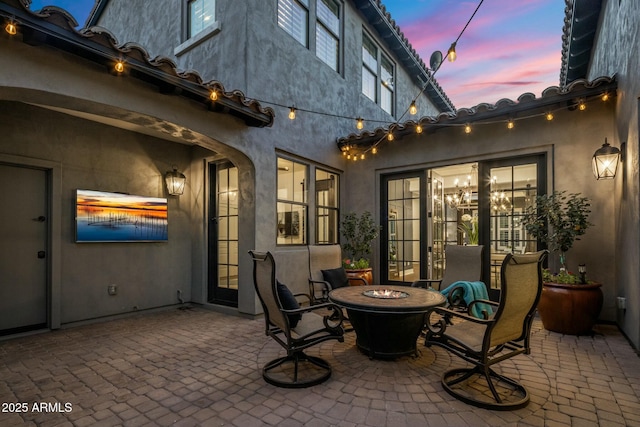 patio terrace at dusk with a fire pit