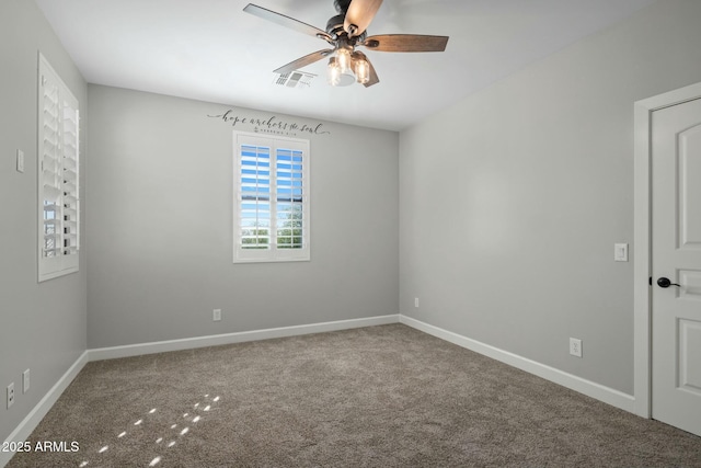 spare room with carpet floors and ceiling fan