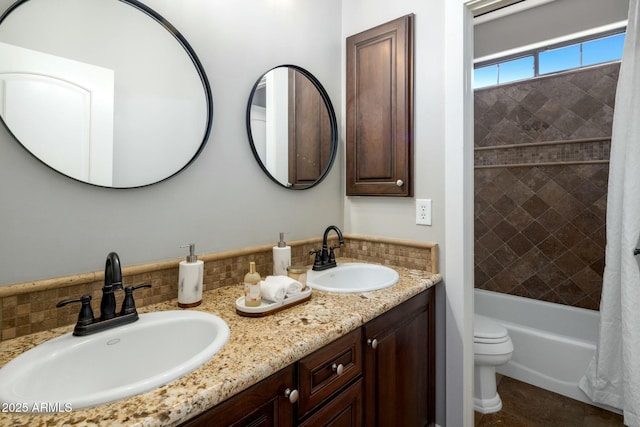 full bathroom featuring tasteful backsplash, vanity, shower / bath combo with shower curtain, and toilet