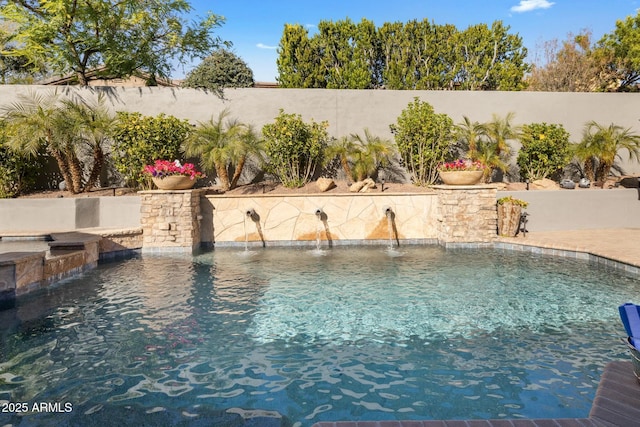 view of swimming pool featuring pool water feature