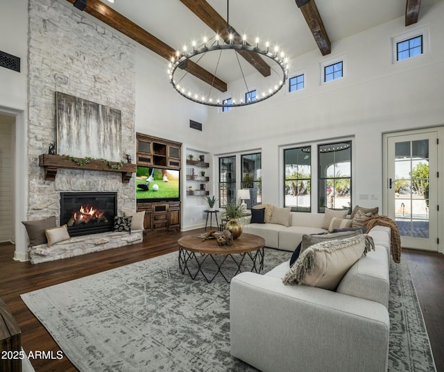 living room with a fireplace, a healthy amount of sunlight, and dark hardwood / wood-style flooring