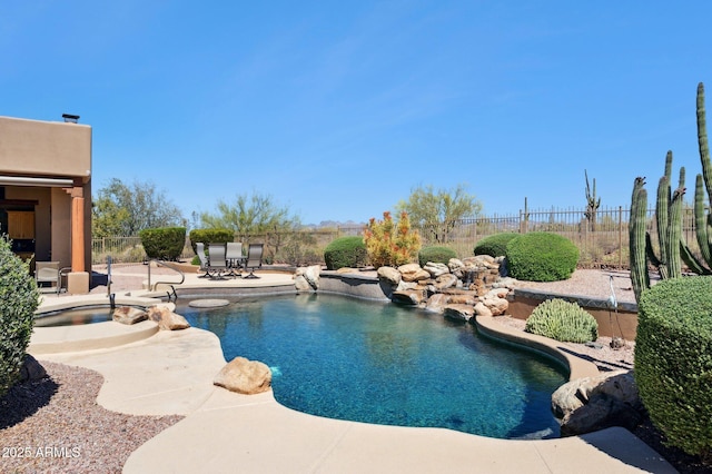 view of pool featuring a patio, a fenced in pool, a fenced backyard, and outdoor dining space