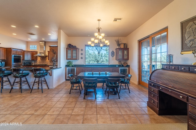 tiled dining room with a notable chandelier and beverage cooler