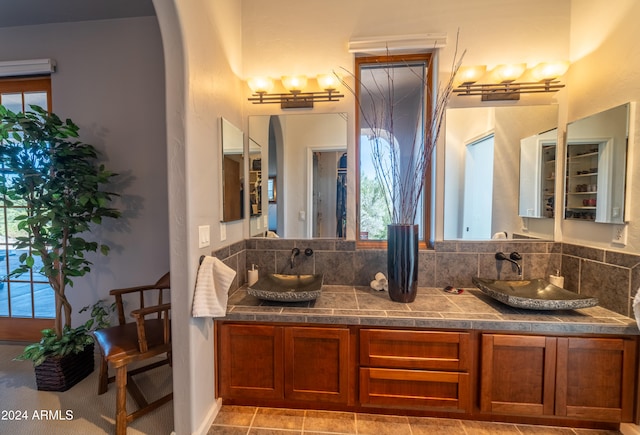 bathroom featuring decorative backsplash and vanity