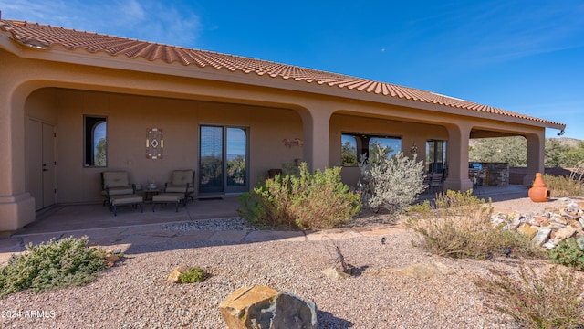 back of property with a patio area