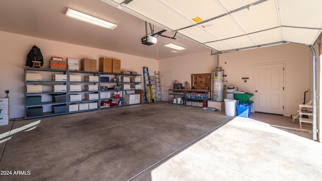 garage featuring water heater and a garage door opener