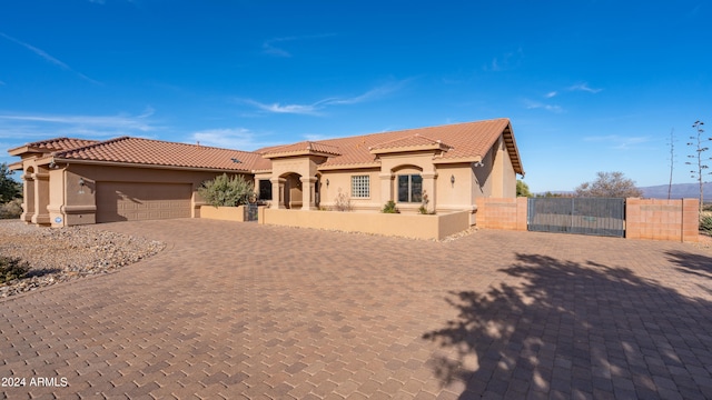 mediterranean / spanish-style house featuring a garage